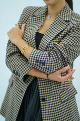 Veste à carreaux noire et beige