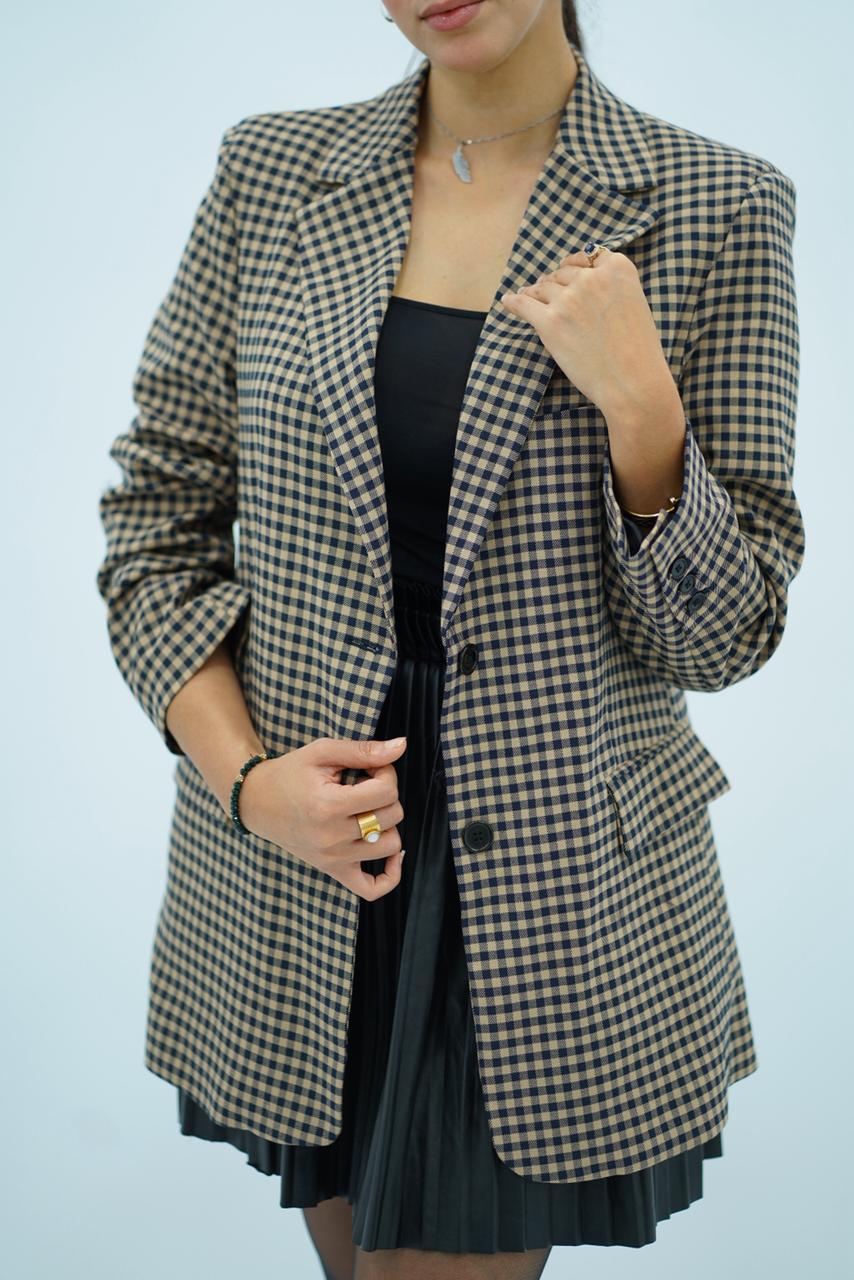 Veste à carreaux noire et beige