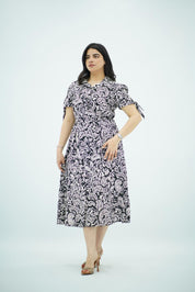 Robe mi-longue à imprimé avec nœuds aux manches